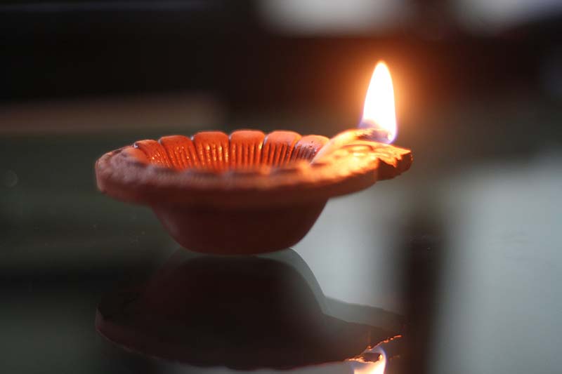 Diya is lighted up on Diwali- all about Diwali