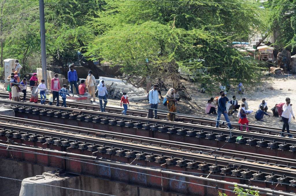 Migrant labours use railway tracks walk to their villages amid the nationwide lockdown, in wake of coronavirus (COVID-19) pandemic in New Delhi